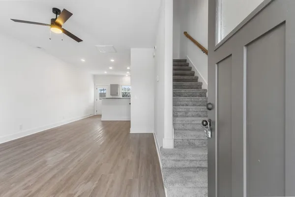 a view of a hallway view with staircase