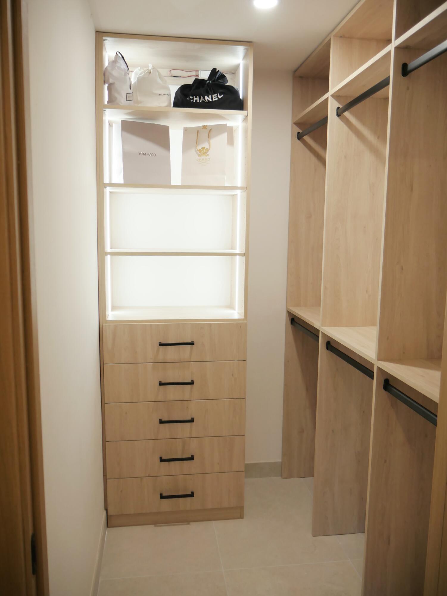 5630 Coach House Circle, Unit D Boca Raton, FL 33486 - Photo 14 of 26 a view of walk in closet