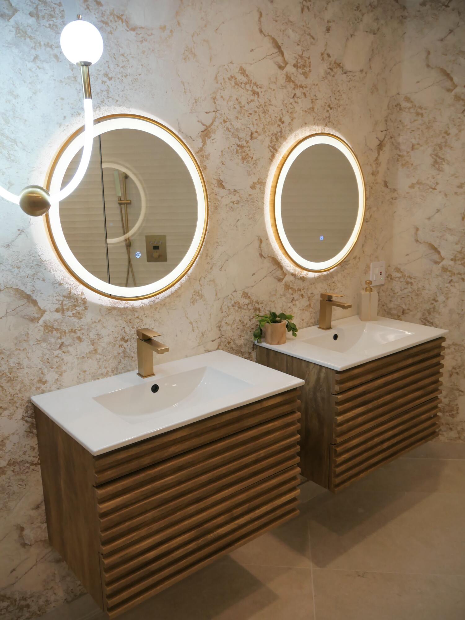 5630 Coach House Circle, Unit D Boca Raton, FL 33486 - Photo 16 of 26 a bathroom with a sink and a mirror