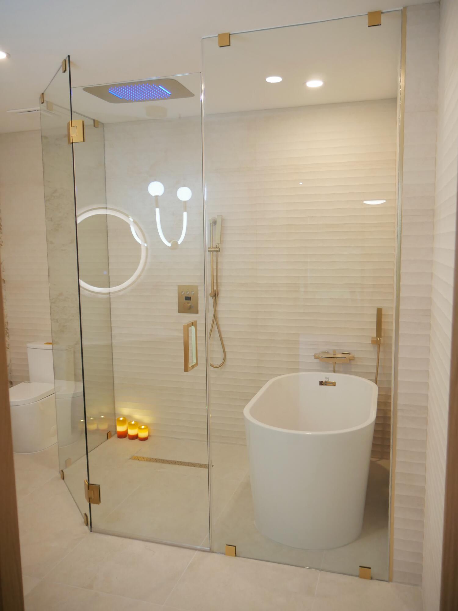 5630 Coach House Circle, Unit D Boca Raton, FL 33486 - Photo 17 of 26 a white bath tub sitting next to a shower