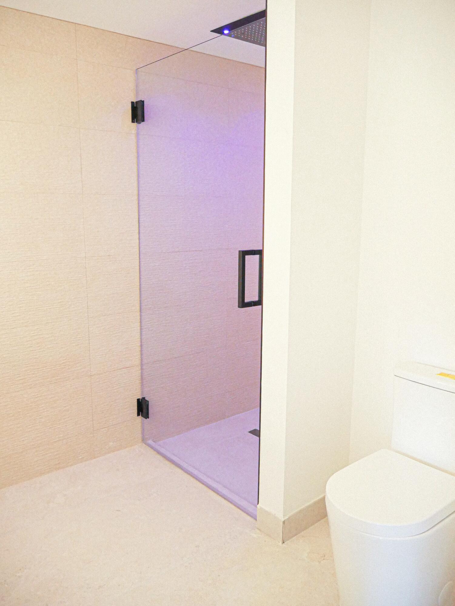 5630 Coach House Circle, Unit D Boca Raton, FL 33486 - Photo 21 of 26 a bathroom with a sink a toilet and shower