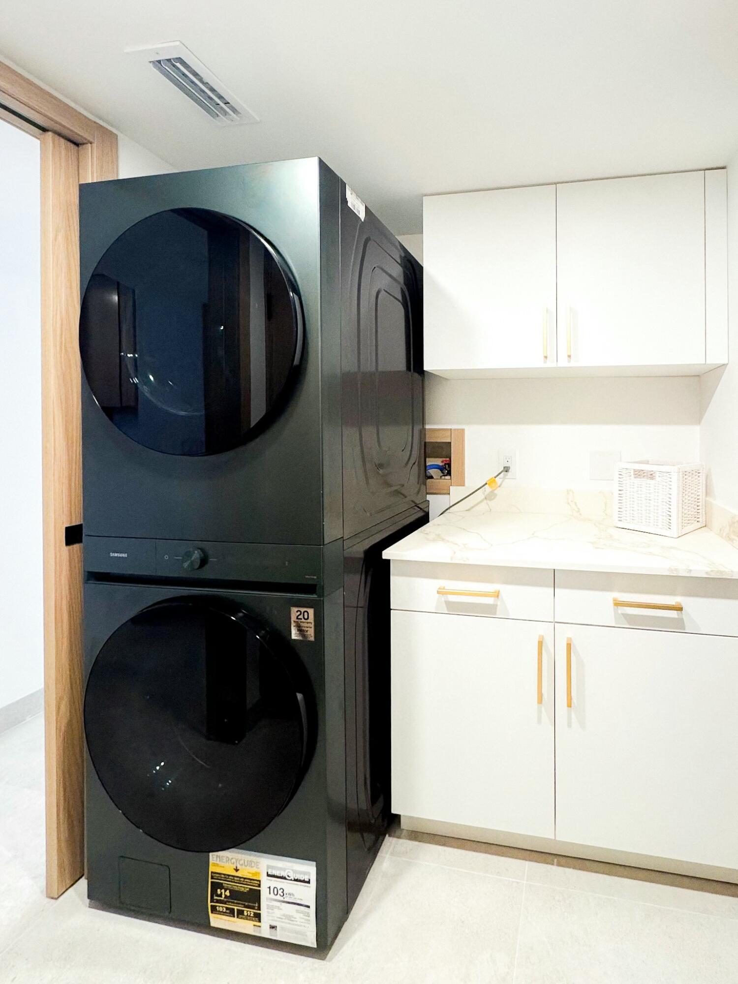 5630 Coach House Circle, Unit D Boca Raton, FL 33486 - Photo 22 of 26 a utility room with dryer and washer