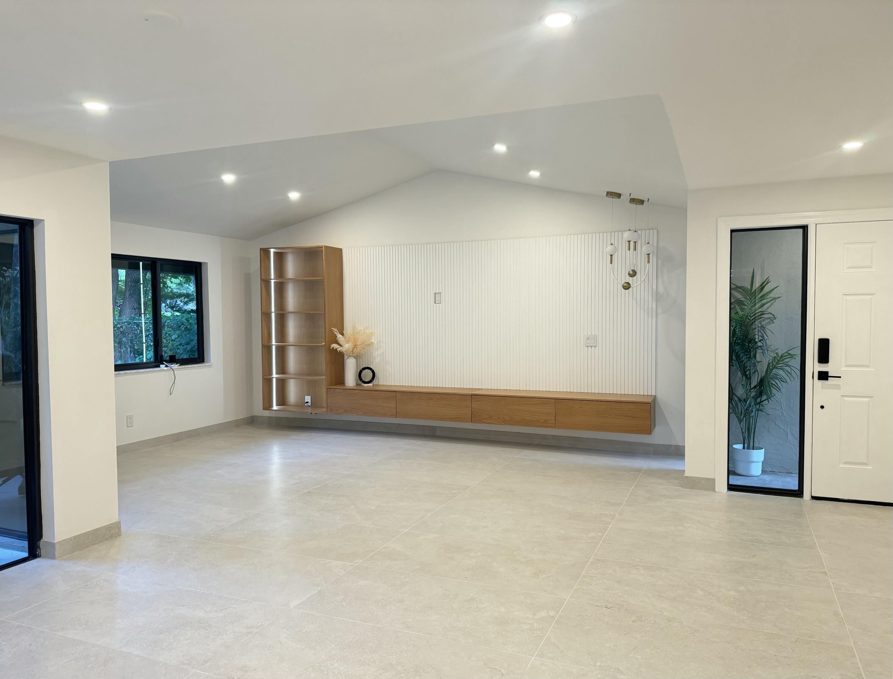 5630 Coach House Circle, Unit D Boca Raton, FL 33486 - Photo 3 of 26 an empty room with windows and entrance