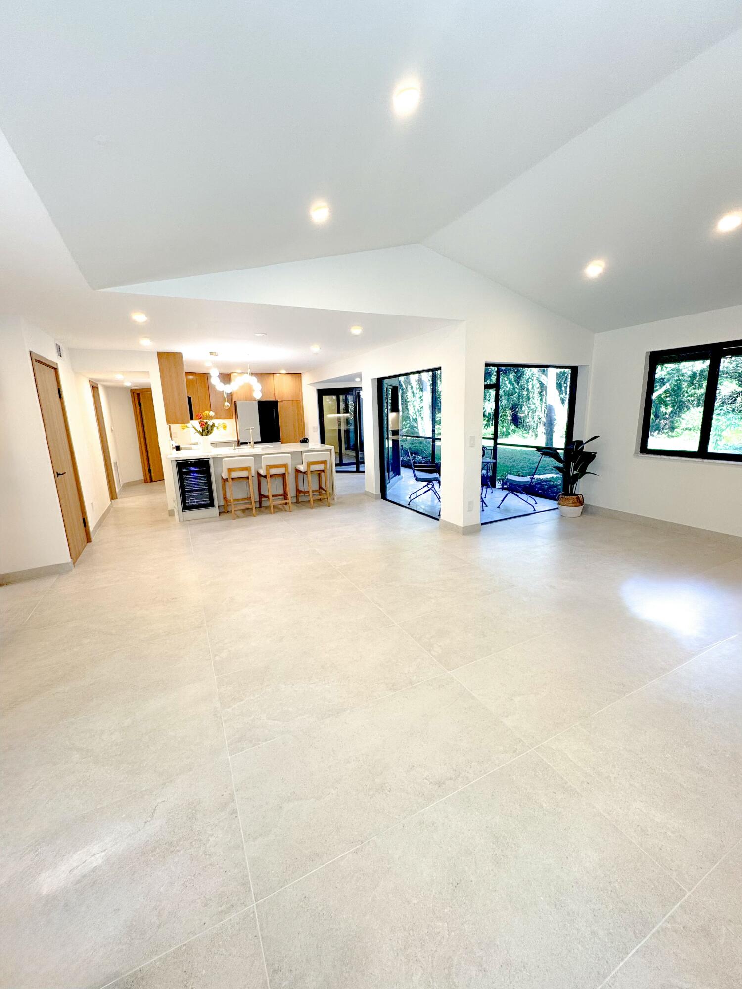5630 Coach House Circle, Unit D Boca Raton, FL 33486 - Photo 4 of 26 a view of a livingroom with furniture and a flat screen tv