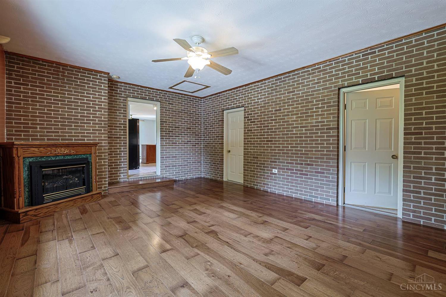 4617 Graybill Road Georgetown, OH 45121 - Photo 21 of 58 This Flex Room Features A Gas Fireplace And Could Be Used As A Family Room, Formal Dining Room Or Even a Huge Fourth Bedroom. It's Large Enough To Fit Into Any Plan You Have For Your New Home! The Exposed Brick Walls Add A Layer Of Warmth And Character That Is Hard To Find In Many Homes.