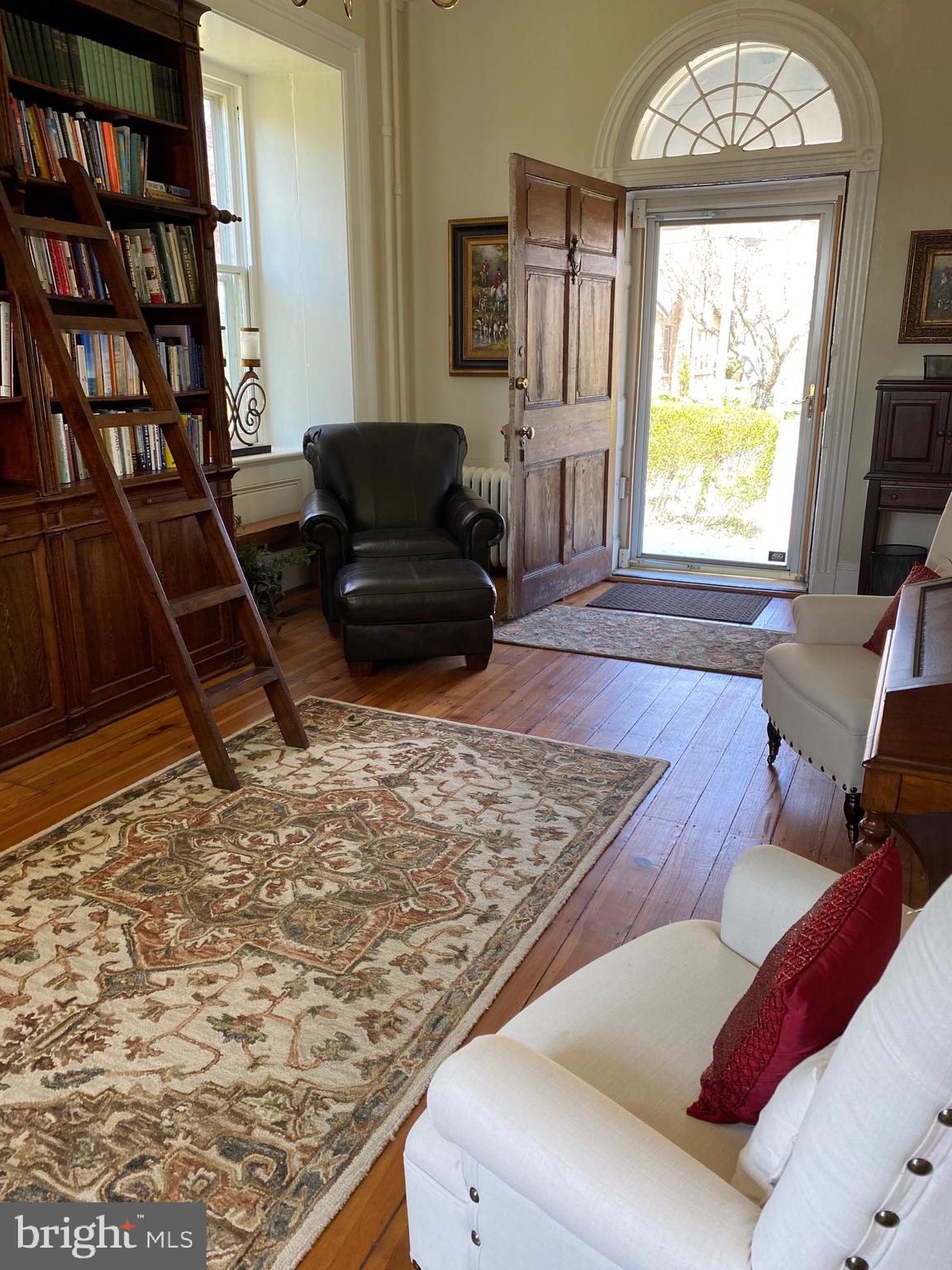 74 Waterloo Street Warrenton, VA 20186 - Photo 13 of 19 a living room with a couch and a bookshelf