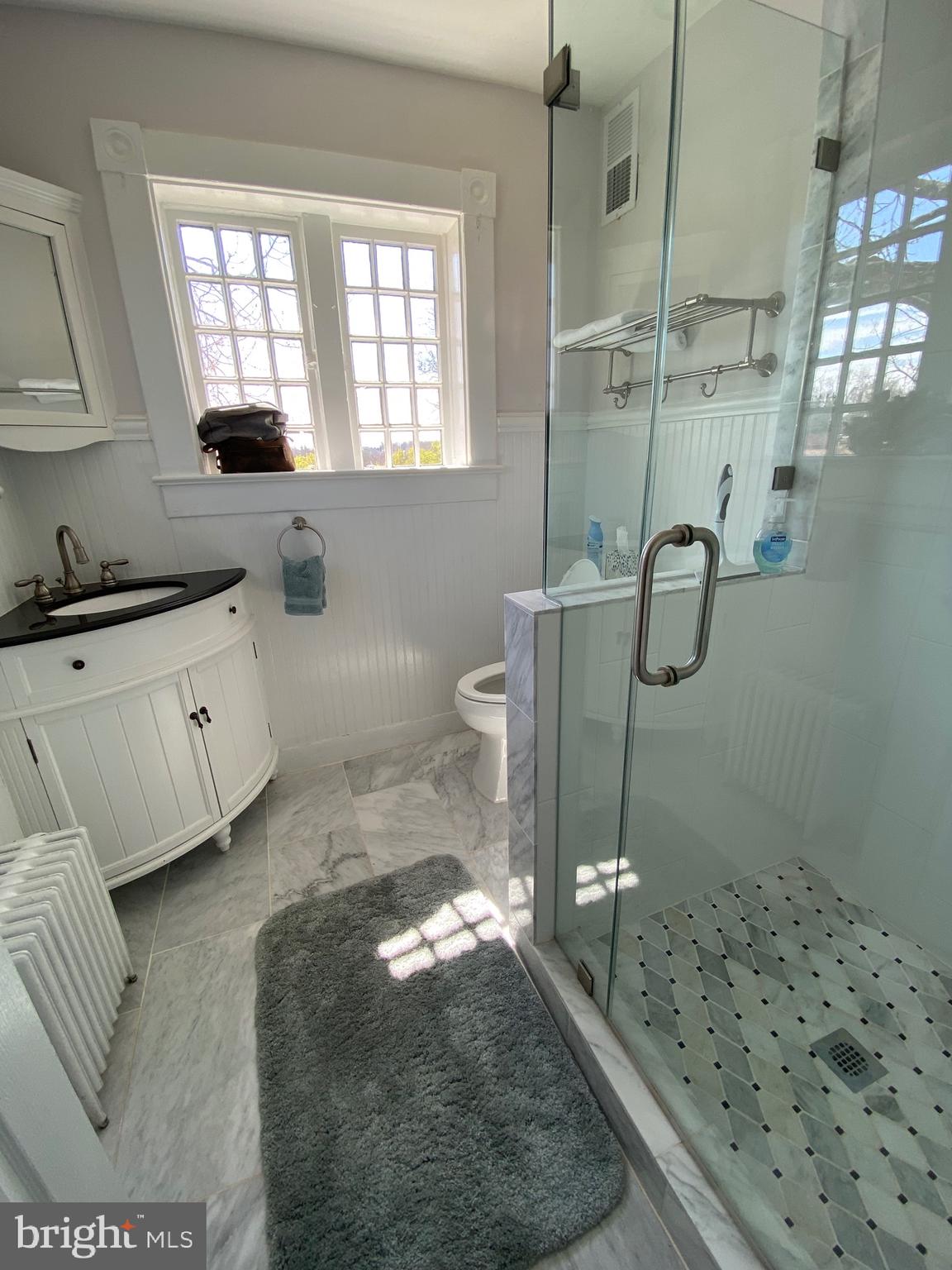 74 Waterloo Street Warrenton, VA 20186 - Photo 15 of 19 a bathroom with a tub sink and glass door