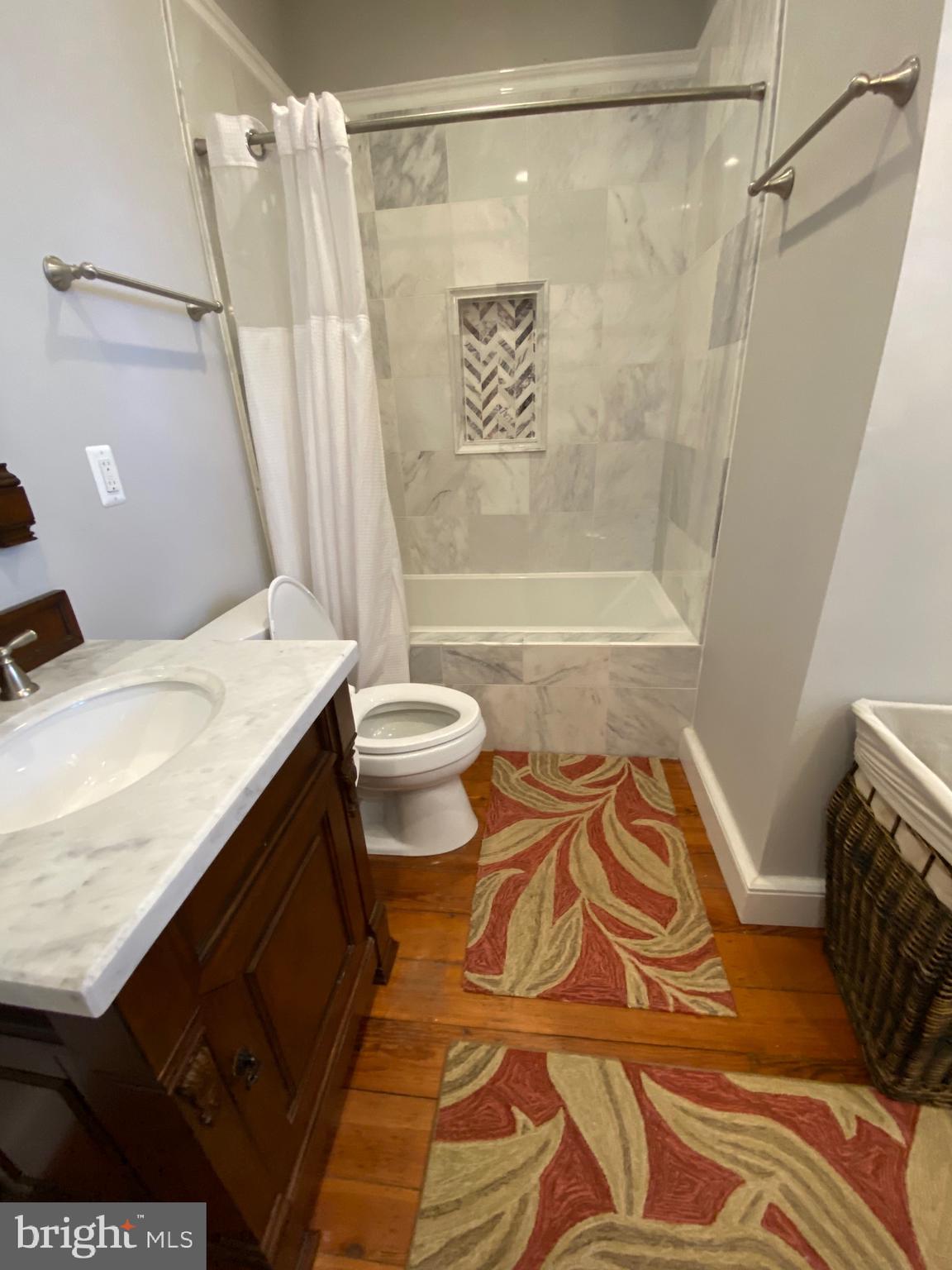 74 Waterloo Street Warrenton, VA 20186 - Photo 17 of 19 a bathroom with a sink a toilet and shower