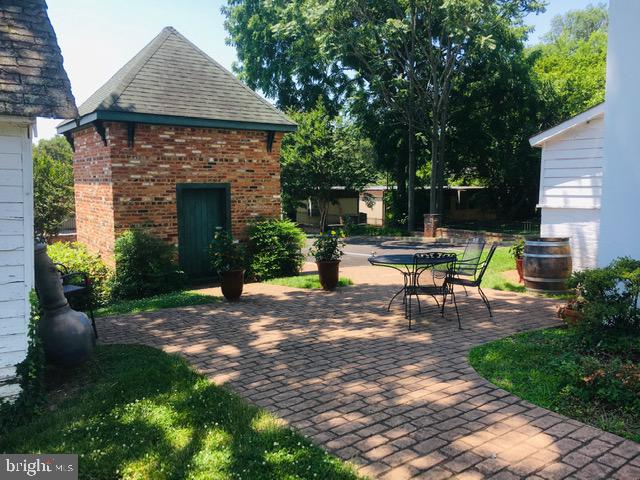 74 Waterloo Street Warrenton, VA 20186 - Photo 19 of 19 a view of a backyard with table and chairs and a fire pit