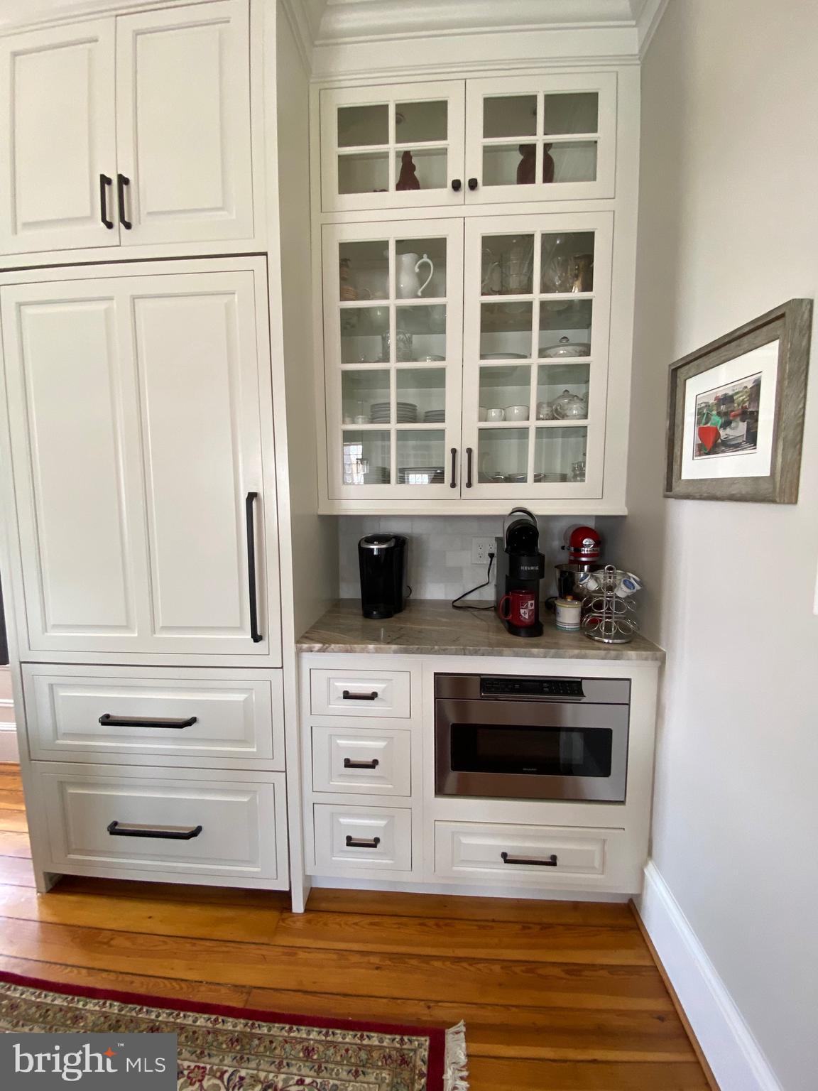 74 Waterloo Street Warrenton, VA 20186 - Photo 5 of 19 a stove top oven sitting inside of a kitchen and white cabinets