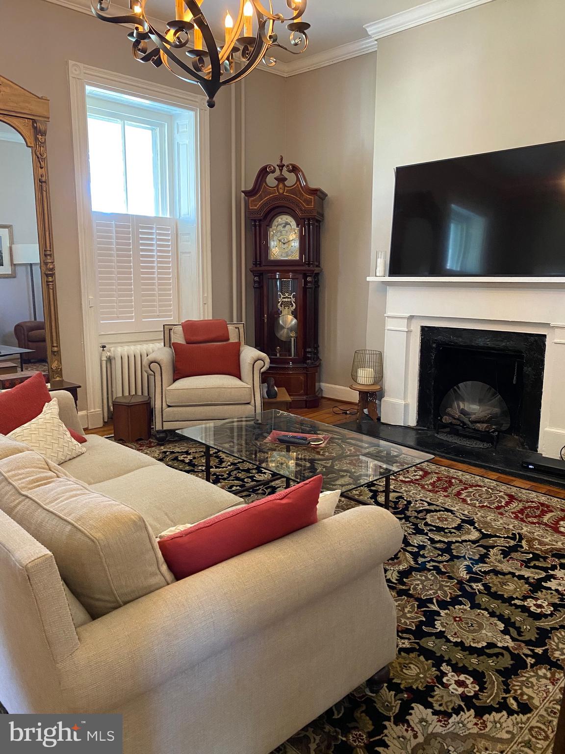 74 Waterloo Street Warrenton, VA 20186 - Photo 8 of 19 a living room with furniture a flat screen tv and a fireplace