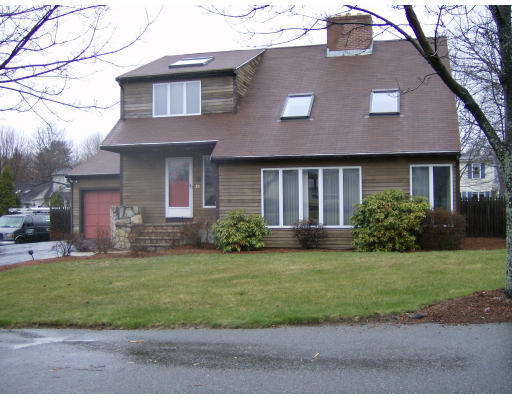35 Pitman Road Marblehead, MA 01945 - Photo 1 of 4 a front view of a house with a yard and garage