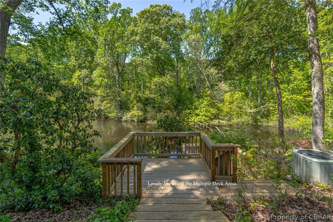 5818 Rivers Landing Terrace, Unit 5818 White Stone, VA 22578 - Photo 36 of 50 Wooden terrace featuring a water view and central AC