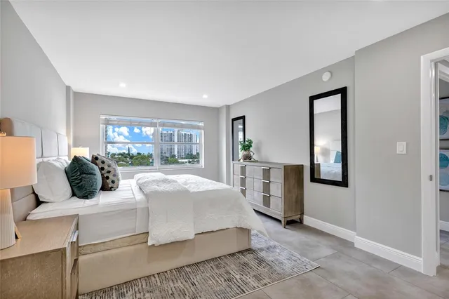 a bed room with a bed and a window