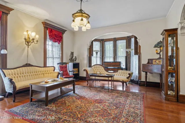 an aerial view of a house with garden space and a patio
