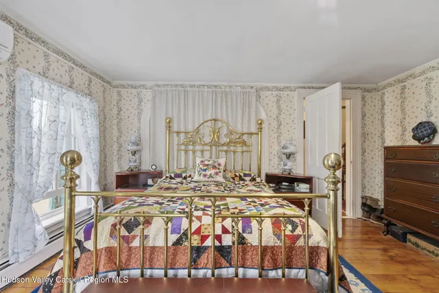 a living room with furniture a rug and a chandelier