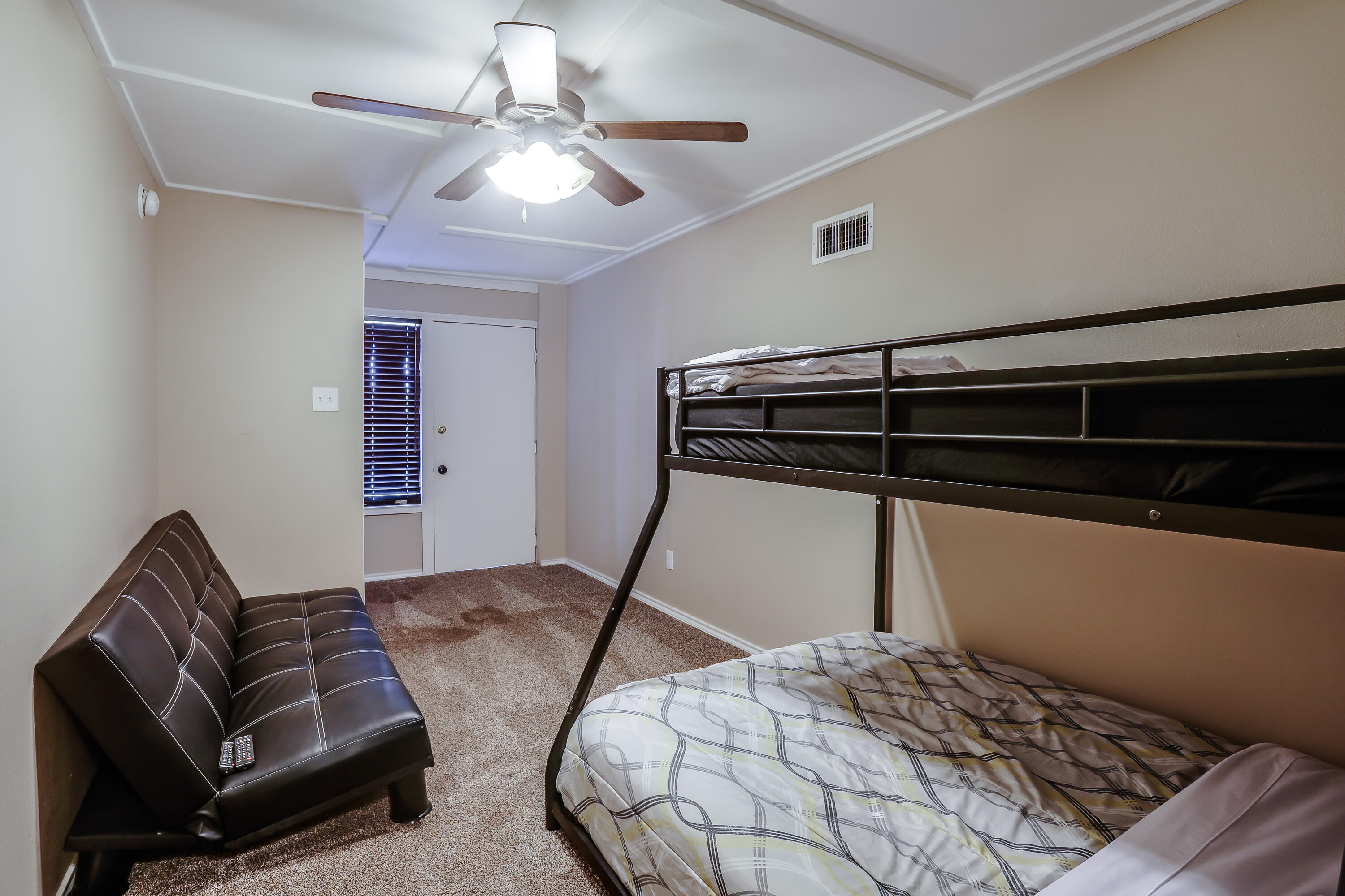 68 Pony Express Trail Lubbock, TX 79404 - Photo 12 of 15 a bedroom with furniture and a ceiling fan