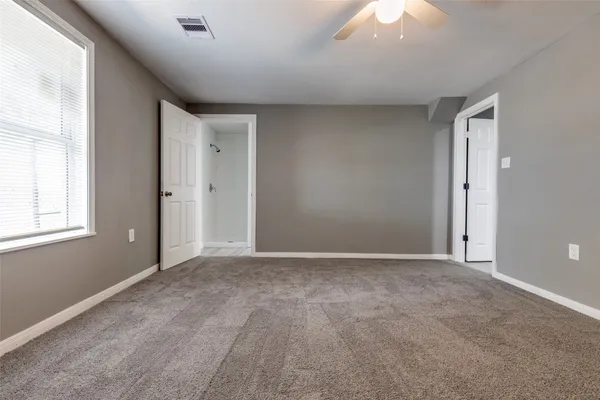 a view of an empty room with a window