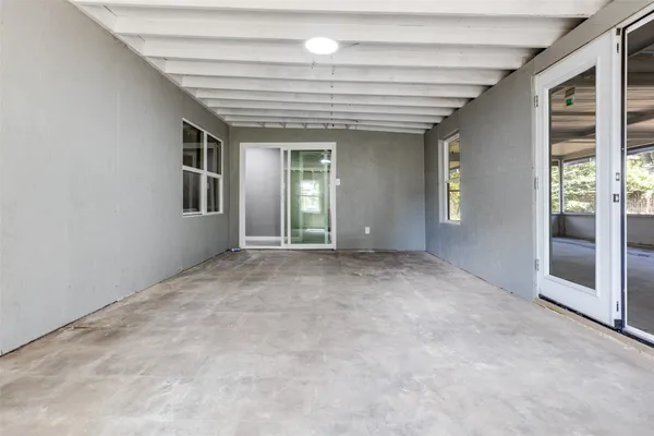 an empty room with windows