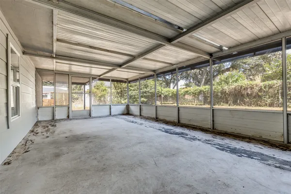 a view of an empty room with a sliding door