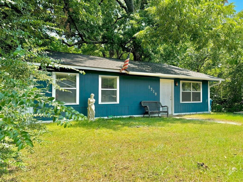 a view of a house with pool and sitting area