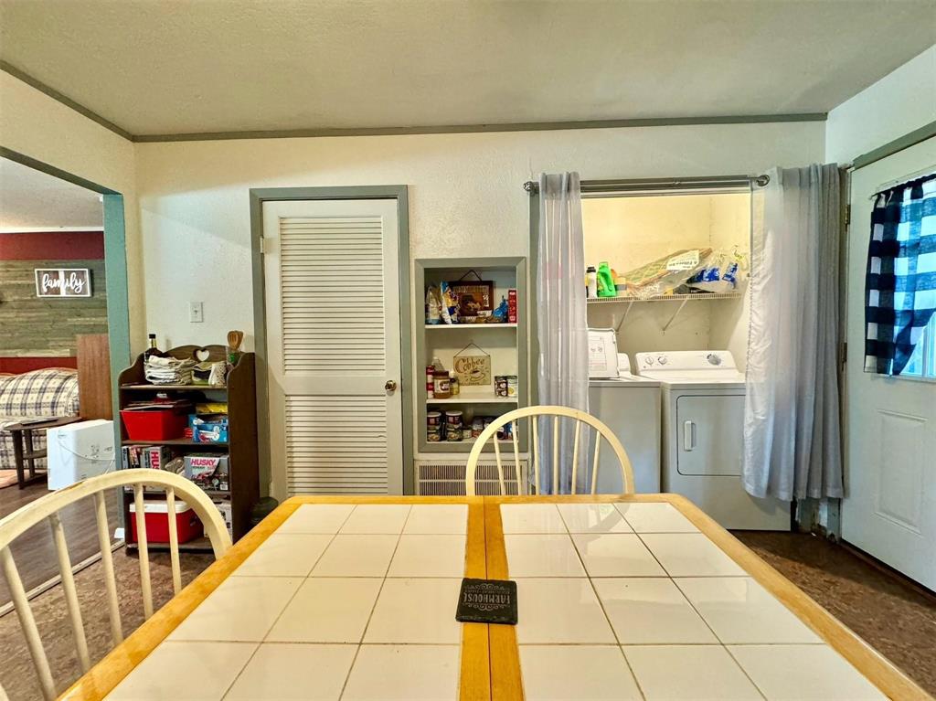 1319 West Morgan Street Denison, TX 75020 - Photo 7 of 17 a bedroom with a bed and a large window