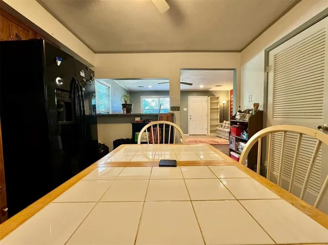 a view of living room with furniture and a window