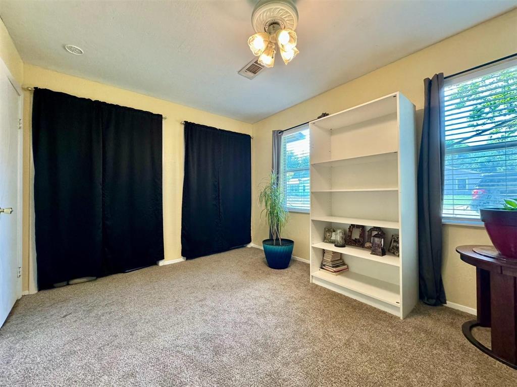 1319 West Morgan Street Denison, TX 75020 - Photo 9 of 17 a view of a room with a flat screen tv