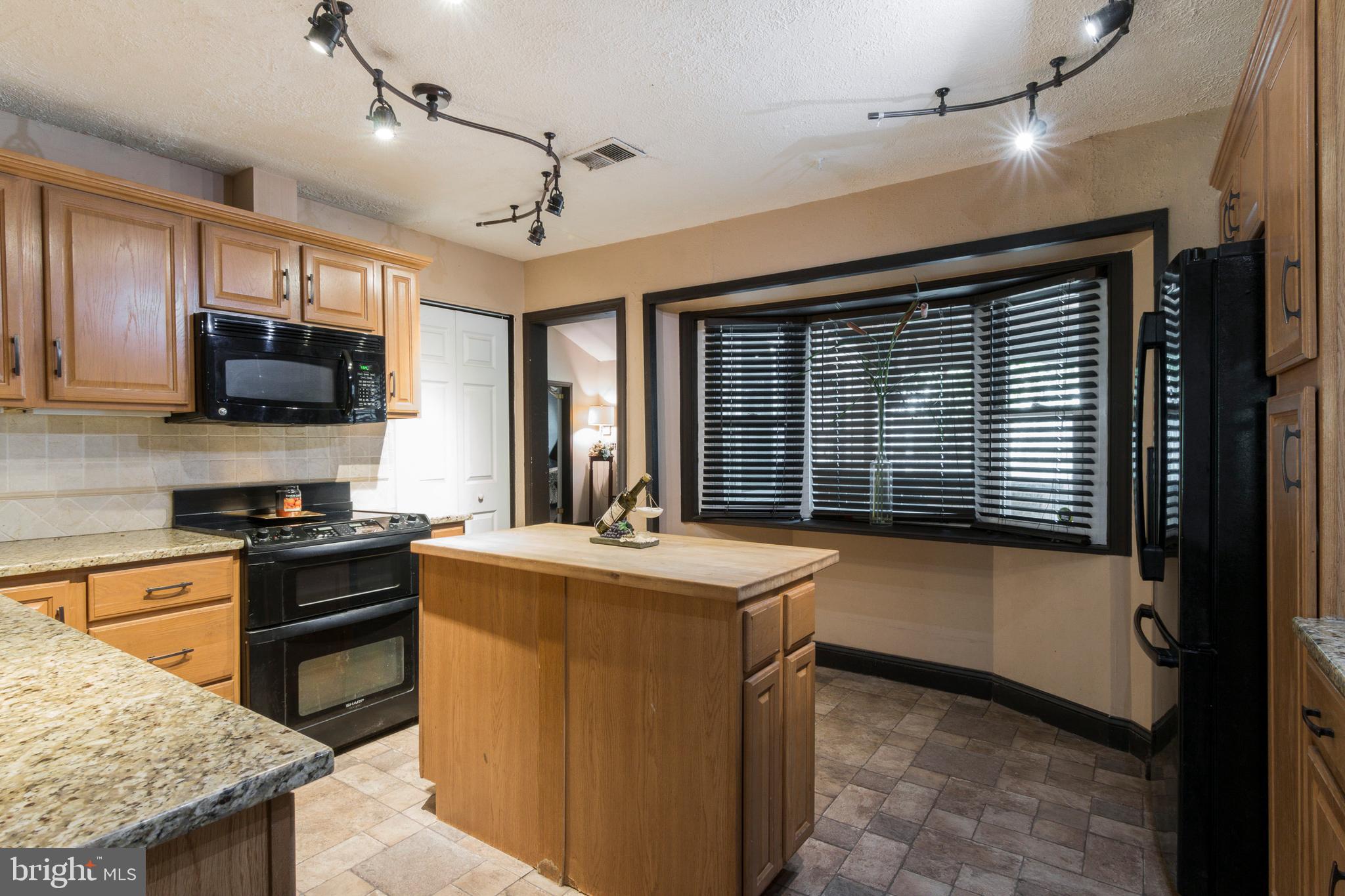 1624 Bay Ridge Road Edgewater, MD 21037 - Photo 14 of 34 Kitchen. Island with room for stools.