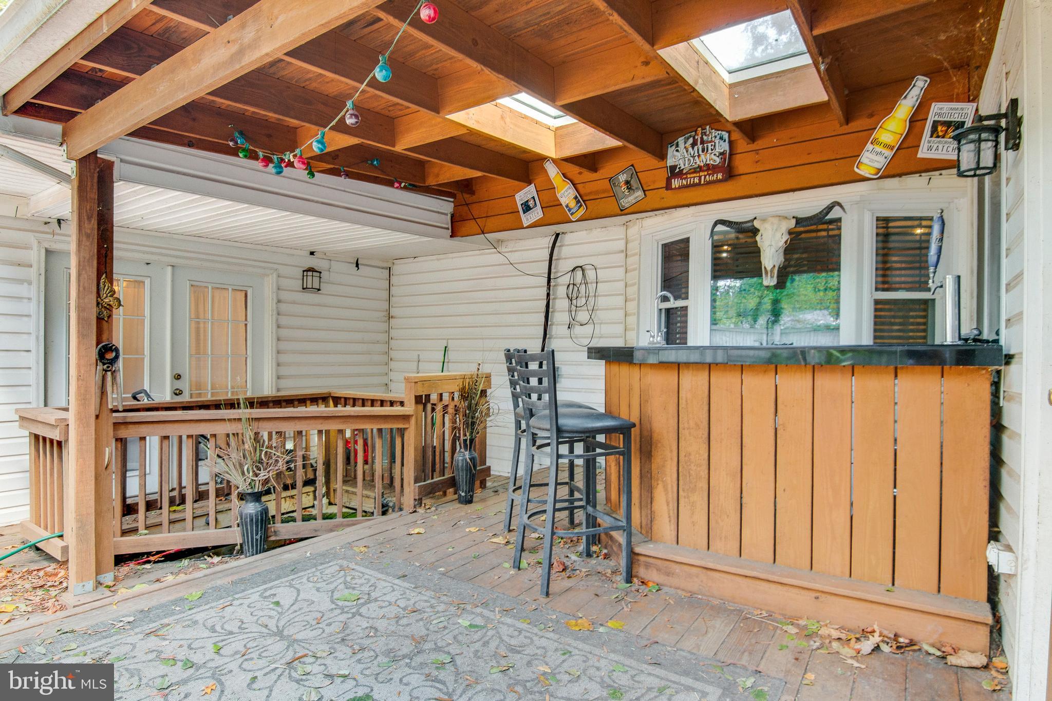 1624 Bay Ridge Road Edgewater, MD 21037 - Photo 28 of 34 Covered back deck with bar and pond
