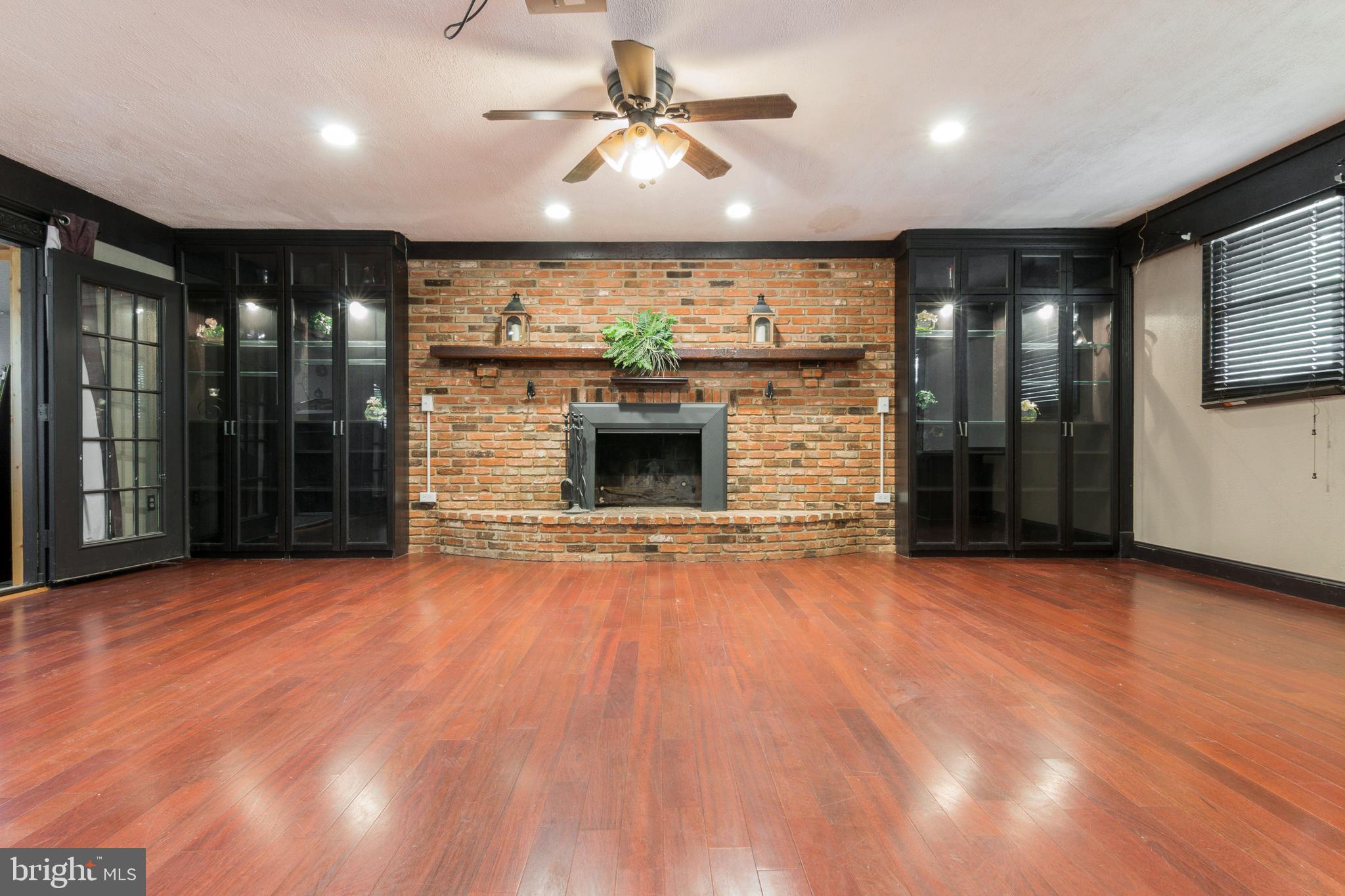 1624 Bay Ridge Road Edgewater, MD 21037 - Photo 7 of 34 Family room with wood-burning brick fireplace.