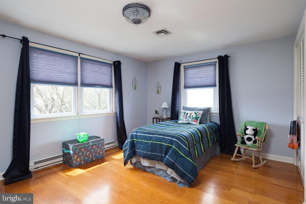 1521 Ryan Road Fallston, MD 21047 - Photo 17 of 25 BEDROOM WITH HARDWOOD FLOORS AND TWO CLOSETS