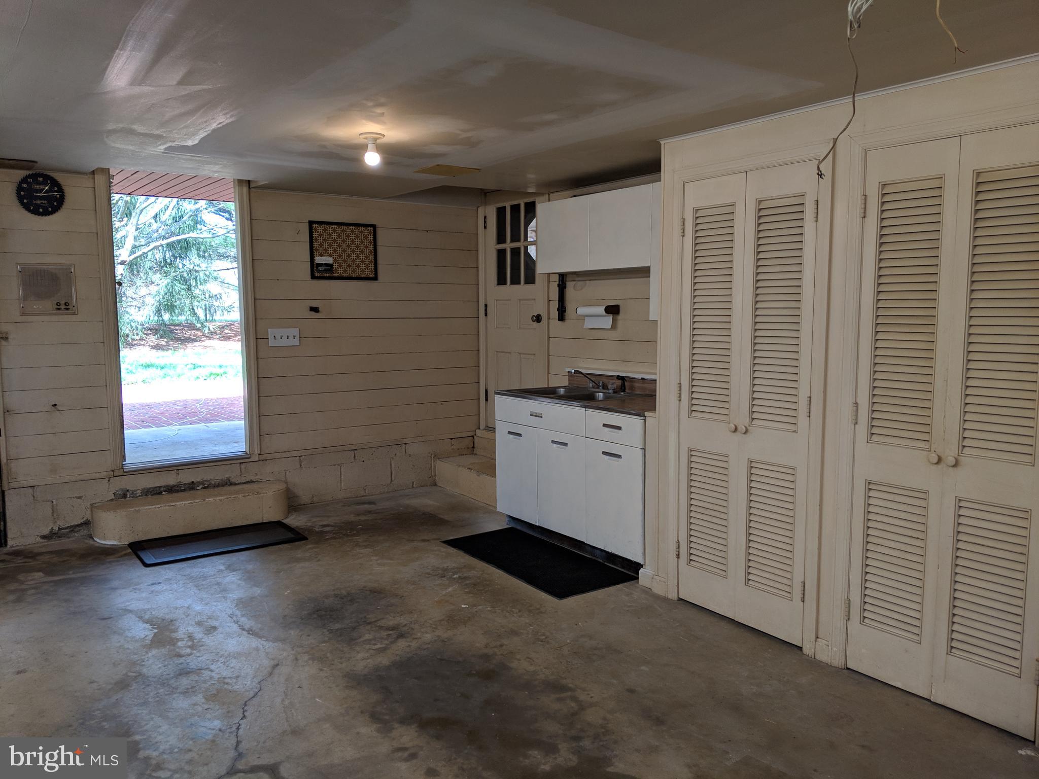 1521 Ryan Road Fallston, MD 21047 - Photo 22 of 25 GARAGE WITH ADDITIONAL STORAGE OPENS TO REAR LAWN