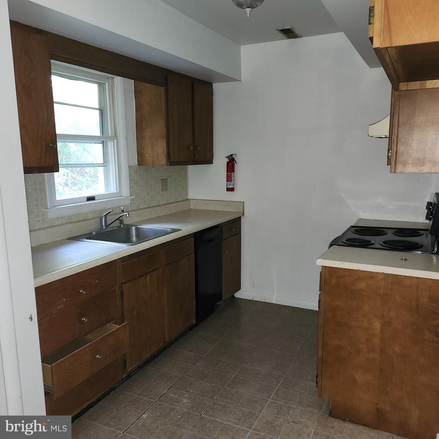 327 A Parkview Road Reading, PA 19606 - Photo 4 of 10 a kitchen with sink a stove and a refrigerator