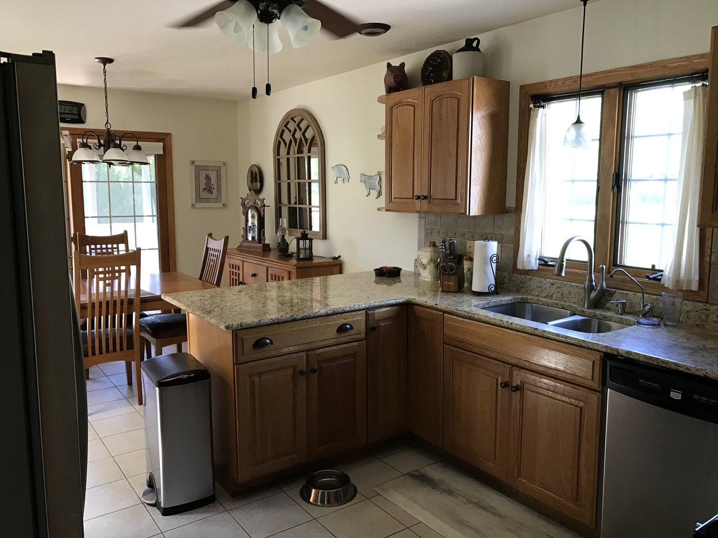 115 Seneca Lane Loda, IL 60948 - Photo 4 of 21 a kitchen with granite countertop a sink stainless steel appliances and cabinets