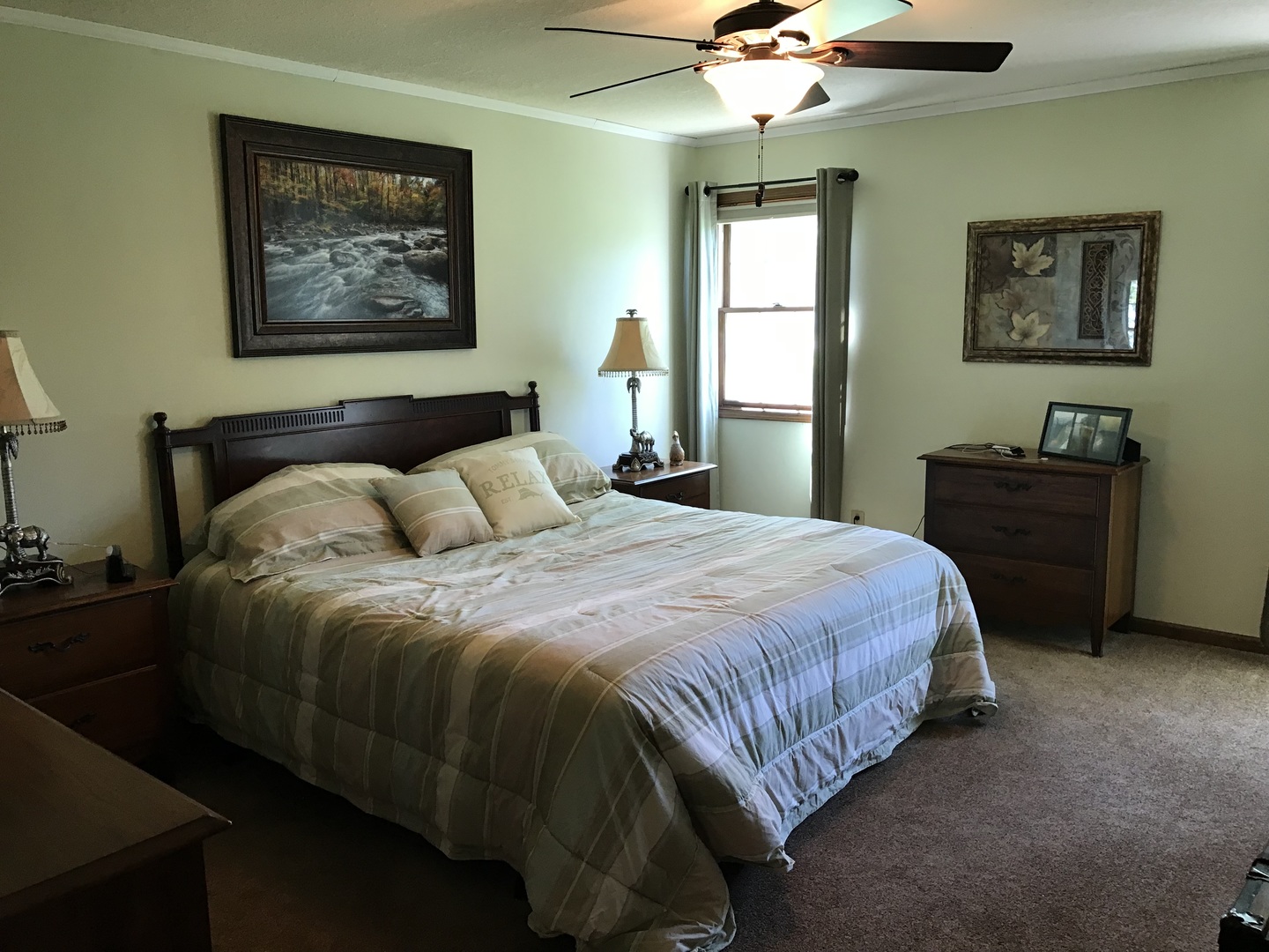 115 Seneca Lane Loda, IL 60948 - Photo 8 of 21 a bedroom with a bed and a chandelier