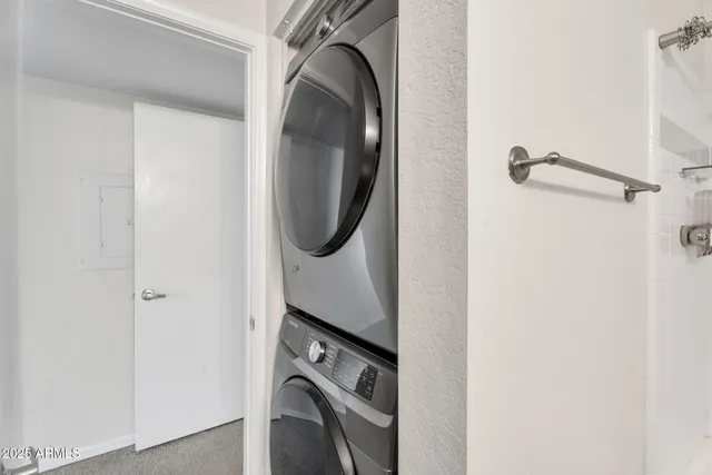 a close view of a utility room with dryer and washer