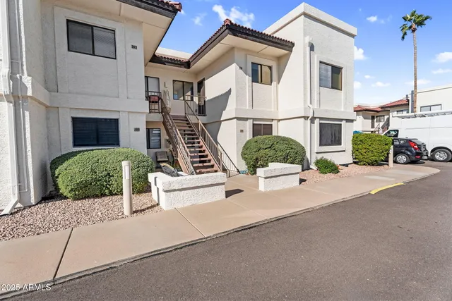 a front view of a house with garage