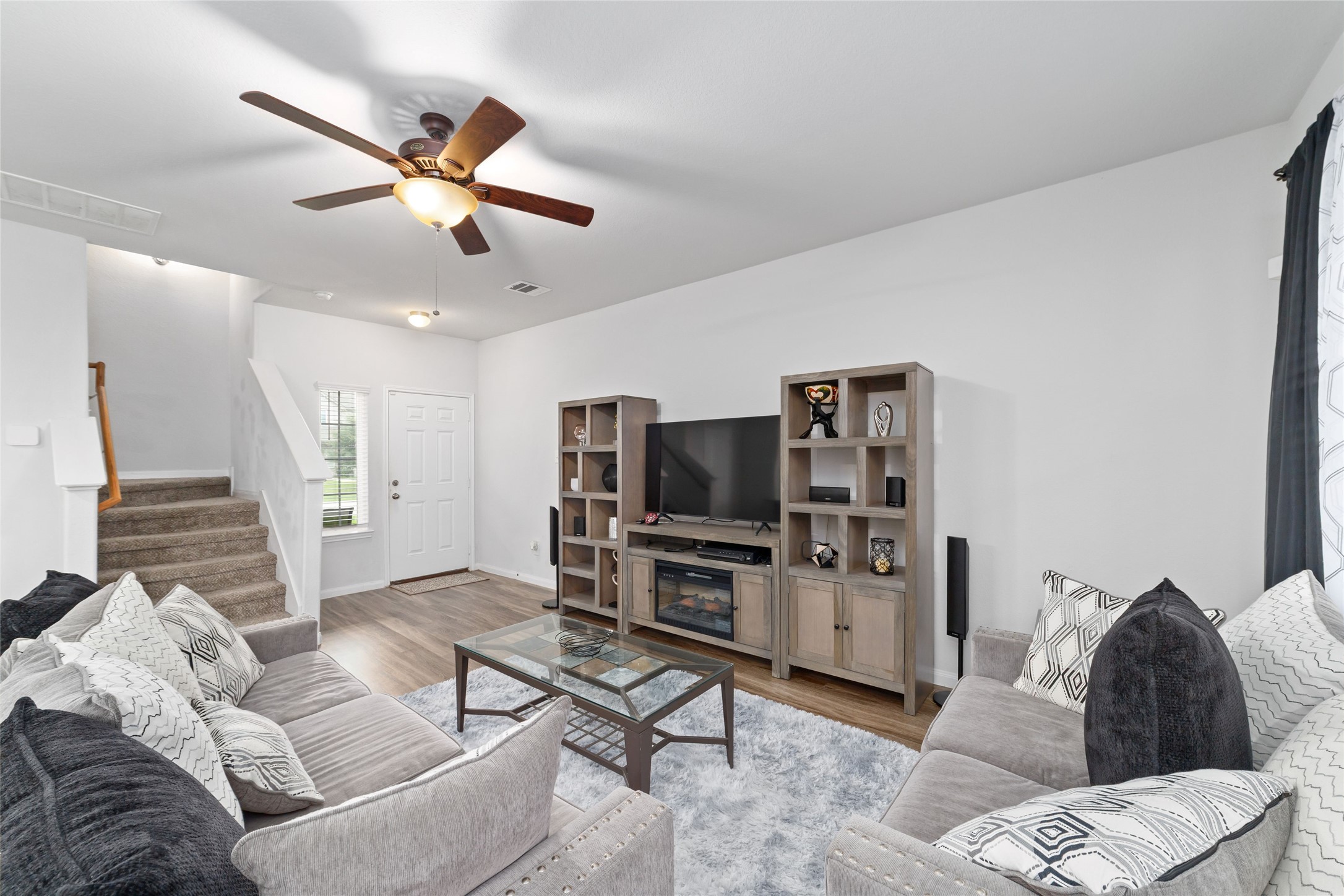 18619 Cooper Ravine Way Katy, TX 77449 - Photo 7 of 23 a living room with furniture and a flat screen tv