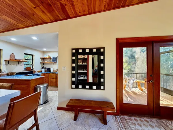 a living room with furniture a rug and a window