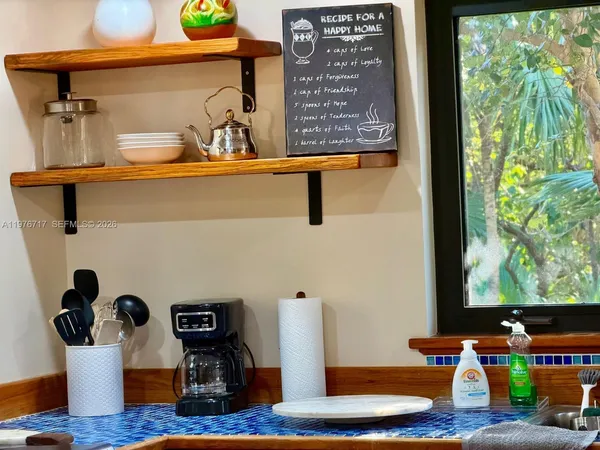 a bedroom with two beds and a window