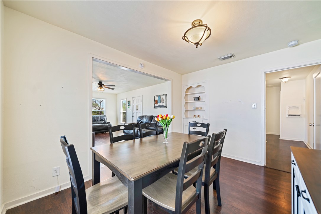 3651 Lawnview Street Corpus Christi, TX 78411 - Photo 12 of 38 a view of a dining room with furniture and wooden floor