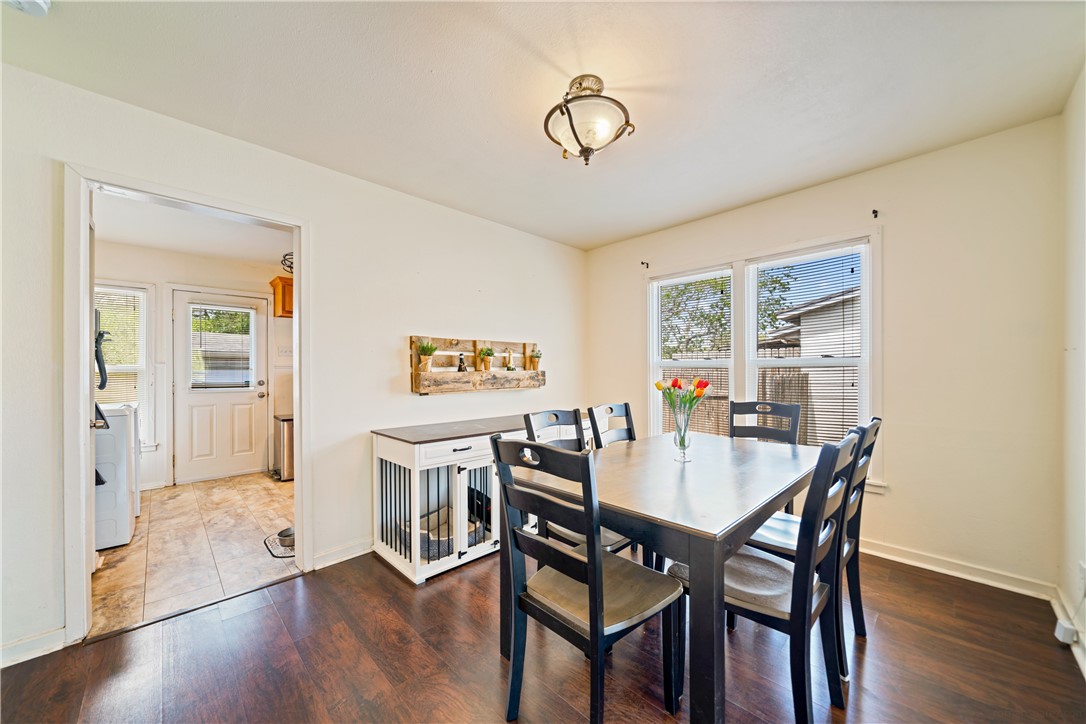 3651 Lawnview Street Corpus Christi, TX 78411 - Photo 13 of 38 a view of a dining room with furniture and wooden floor