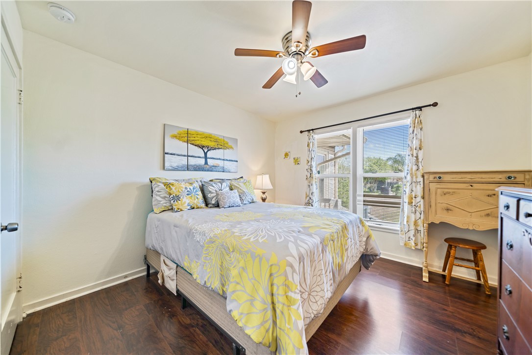 3651 Lawnview Street Corpus Christi, TX 78411 - Photo 20 of 38 a bedroom with a bed and a chandelier