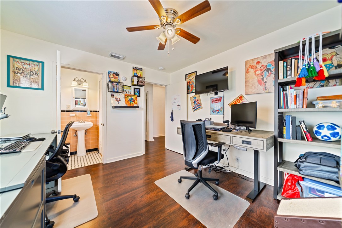 3651 Lawnview Street Corpus Christi, TX 78411 - Photo 23 of 38 a view of a workspace with furniture and a flat screen tv