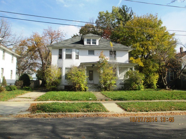 459 North Spring Street Elgin, IL 60120 - Photo 1 of 6 a front view of a house with a yard