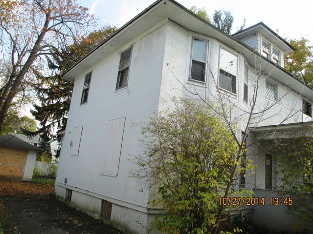 459 North Spring Street Elgin, IL 60120 - Photo 2 of 6 a front view of a house with trees