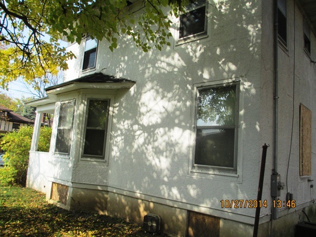 459 North Spring Street Elgin, IL 60120 - Photo 6 of 6 a front view of a house with parking