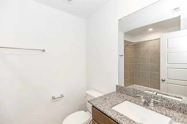a bathroom with a shower and a sink
