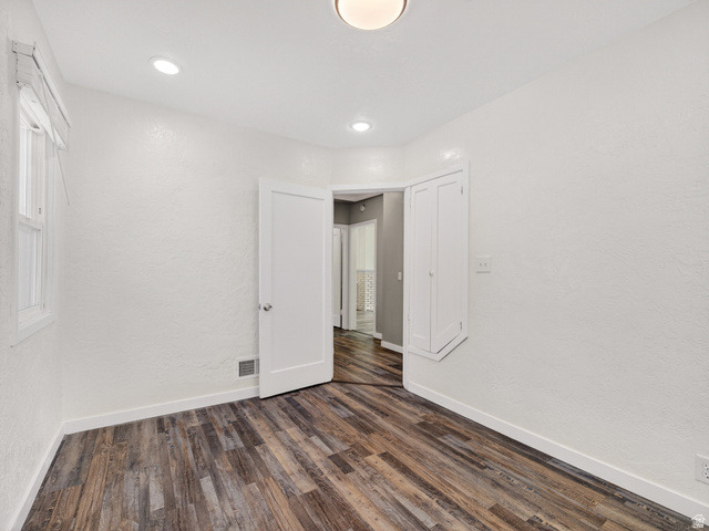74 South 300 East Springville, UT 84663 - Photo 18 of 48 Room featuring wood-finish flooring, white baseboards, and textured white walls